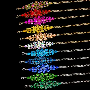 Close-up detail of luxury rhinestone waist chains in multiple colors for evening dresses