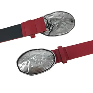 Punk style red leather belt featuring a heavy silver irregular textured metal buckle