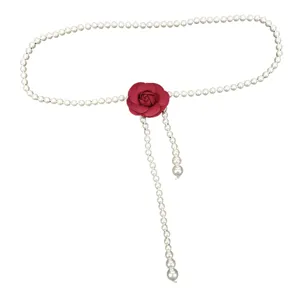 Elegant white pearl waist chain belt featuring a red rose flower decoration for dresses.