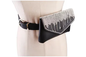 Close-up of black leather belt bag featuring silver rhinestone fringe on female mannequin