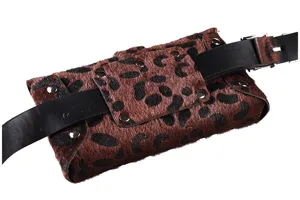 Detailed macro view of leopard print pony hair waist bag with black leather belt detail