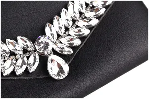 Close-up of elegant rhinestone embellishments on a black leather waist belt bag.