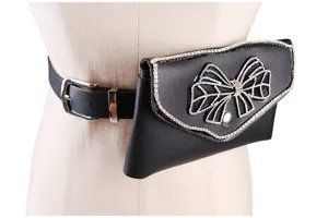 Detail of black leather belt bag with elegant rhinestone bow decoration for women