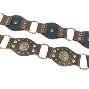 Vintage Y2K aesthetic belt with brown leather, brass rivets and decorative metal rings