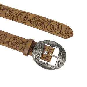 Close-up of vintage brown belt with floral embossing and ornate buckle detail