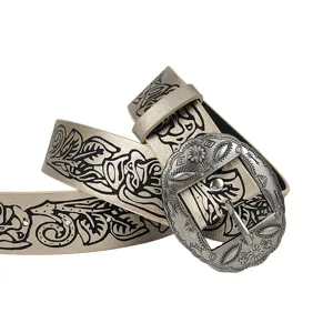 Close-up of vintage silver buckle and floral printed pattern on metallic belt