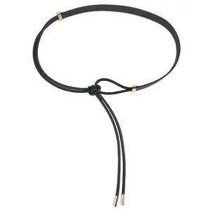 Minimalist black thin knotted waist belt for women with elegant gold-toned metal accents