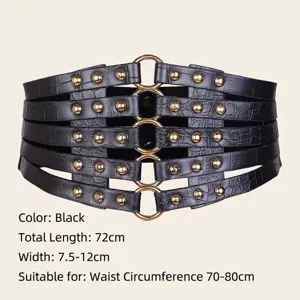 Detail of black crocodile texture corset belt with golden rivets and ring buckles.