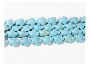 Detailed close-up view of blue turquoise turtle beads for DIY jewelry making crafts