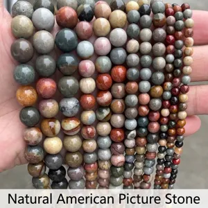 Vista dettagliata di perle tonde naturali in Picture Jasper per la creazione di gioielli