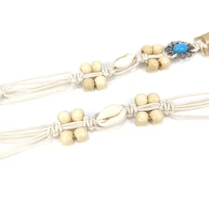 Handmade Bohemian macrame waist belt with cowrie shells and decorative wooden beads