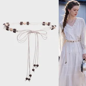 Elegant Bohemian woven waist belt with wooden beads perfect for beach dresses and casual wear