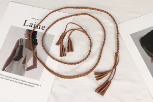 Macro view of the vintage brown braided waist rope belt featuring elegant tassels.