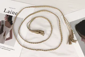 Detailed view of vintage braided waist rope with bohemian tassel accents for dresses