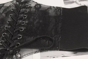 Detail of black lace elastic waist seal with lace-up front and floral patterns