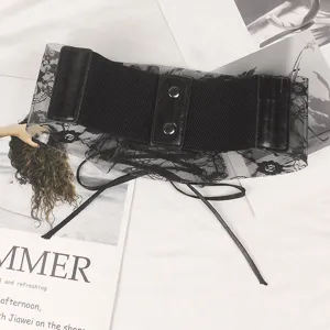 Close-up detail of a black floral lace elastic wide corset belt with elegant snap buttons.