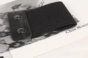 Detailed close-up of a black lace elastic wide waist belt featuring metal snap buttons