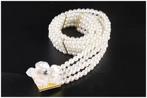 Close-up of four-row pearl elastic belt with rhinestone flower buckle