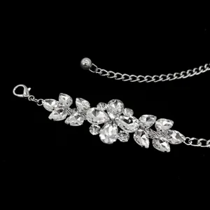 Sparkling silver chain belt featuring a cluster of clear rhinestones for dresses.