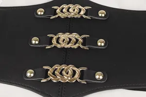 Détail de près montrant les trois boucles dorées décoratives sur la large ceinture élastique noire