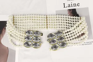 Elegant multi-strand pearl elastic waist belt for women with crystal rhinestone buckle detail