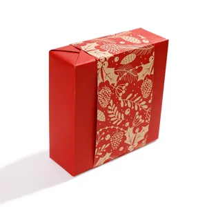 Elegant red gift box wrapped in Christmas pine cone patterned kraft paper sleeve decoration