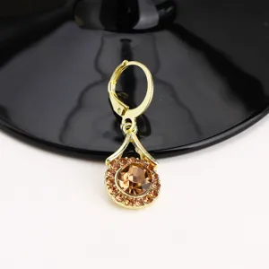 Elegant gold teardrop earrings with brown zircon gemstone, luxury jewelry design for women