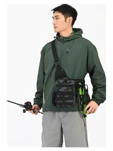 Detail view of a men's outdoor camouflage sling bag worn while fishing on white background