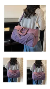 Detailed back view of the purple grid pattern travel bag being carried over the shoulder