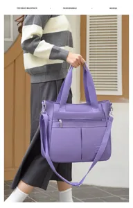 Detailansicht der großen lila Nylontasche mit Schultergurt und zwei Fronttaschen