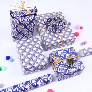 Premium blue gift wrapping paper with traditional fan pattern for DIY present boxing