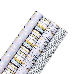 Assortiment de rouleaux de papier cadeau en kraft blanc aux motifs animaux et géométriques