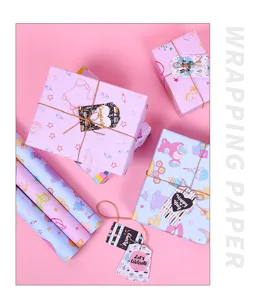 Close-up detail of cartoon baby wrapping paper with wrapped gift boxes and cute matching tags