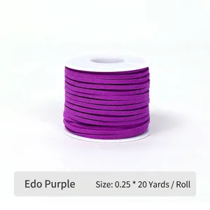 Detailed view of Edo Purple faux suede cord on a white spool for gift wrapping.