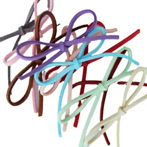 Set of colorful suede velvet gift wrapping ribbons tied in elegant bow knots for florist