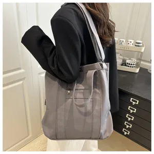 Large capacity casual grey canvas tote bag with adjustable strap for daily use.
