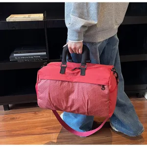 Large red multi-functional lightweight travel duffle bag for gym and business trips handheld