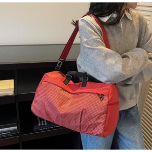 Close-up of a lightweight red multi-functional large capacity travel gym bag for women.