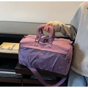 Close-up of a purple large capacity travel gym bag with mesh grid design