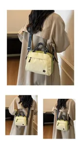 Detailed view of the stylish lightweight multi-layer crossbody bag from multiple back angles.