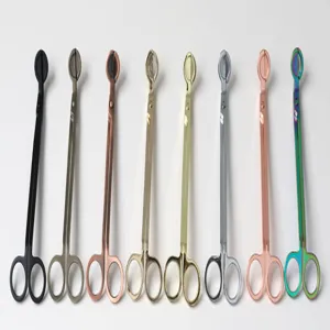 Macro view of multi-colored stainless steel candle wick trimmers in various metallic finishes