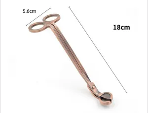 Retro copper stainless steel candle wick trimmer detail, long handle for easy candle care.