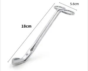 Silver stainless steel candle wick trimmer detail showing 18cm length and 5.6cm width