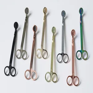 Detail shot of stainless steel candle wick trimmers in multiple metallic color options.