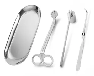 Close-up detail of 4-piece stainless steel candle accessory set on a white background