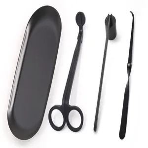 Detailed view of 4-piece matte black stainless steel candle care set on white background