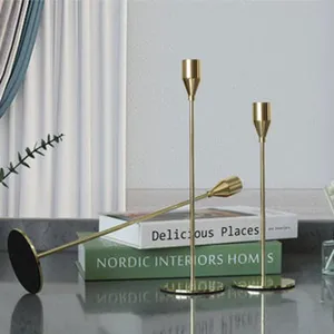 Modern gold metal candlestick holders set, elegant minimalist long stem design for home decor table.