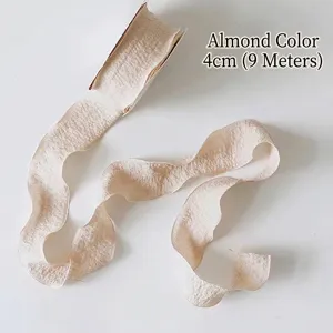 Detailed view of apricot ruffled bubble yarn ribbon 4cm wide for flower bouquet packaging