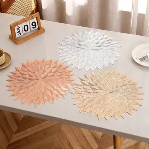 Set of three heat-resistant PVC placemats with elegant leaf-shaped design in various colors.