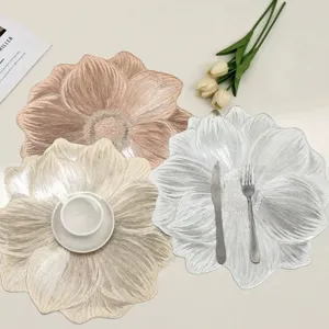 Elegant flower-shaped PVC placemats in metallic gold, silver, and copper textured finishes